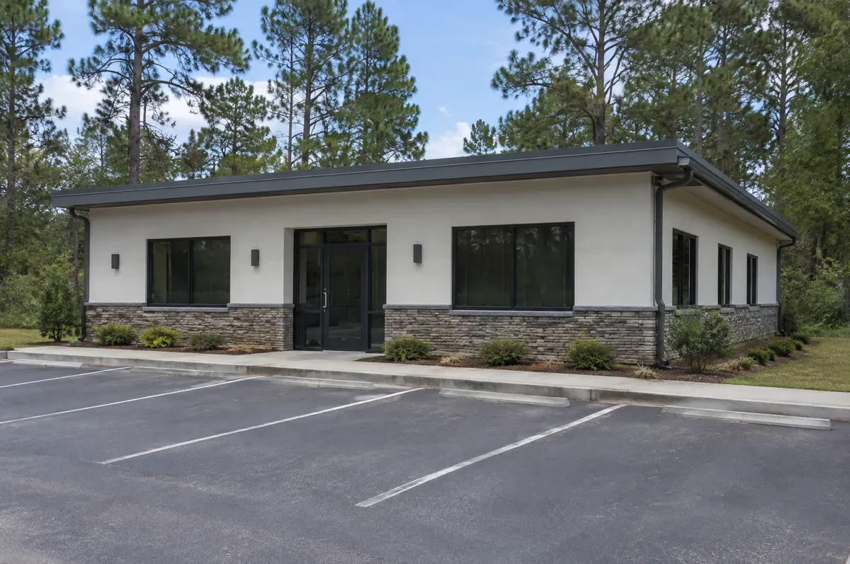 Small office building with gutters and downspouts