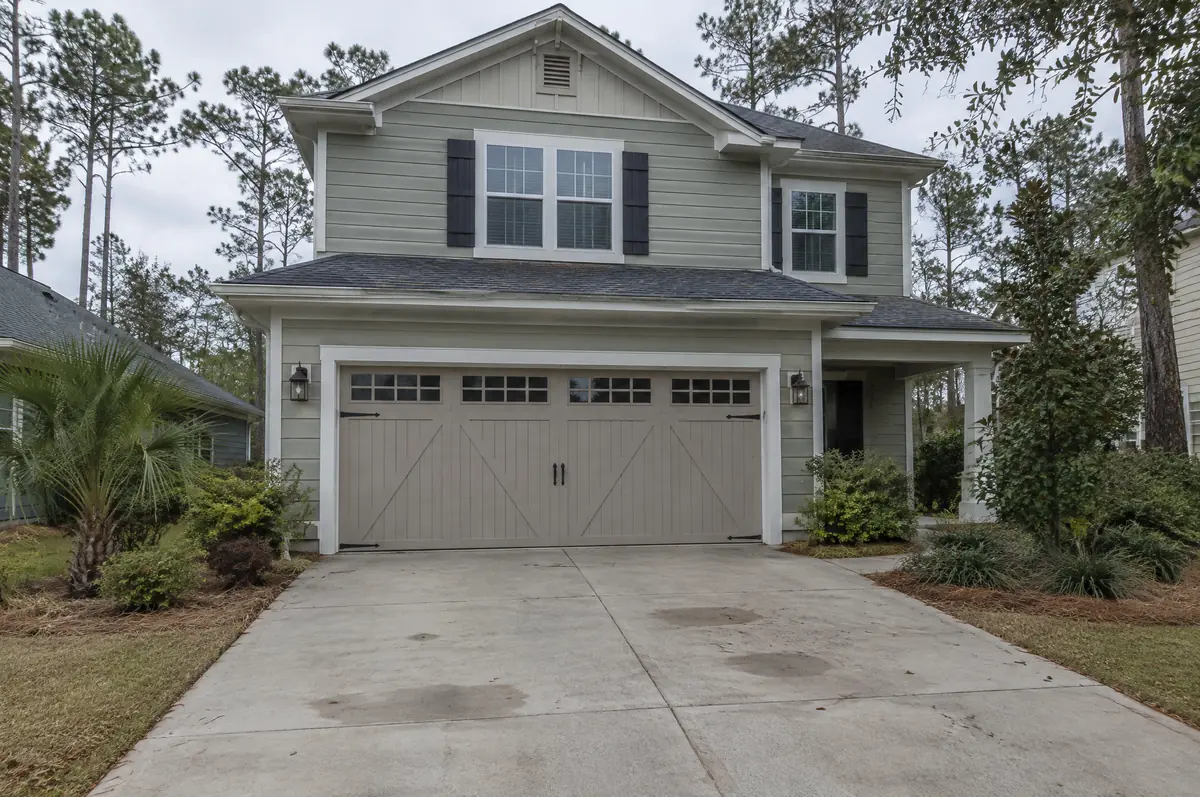 Two-story home with a carriage-house style garage door