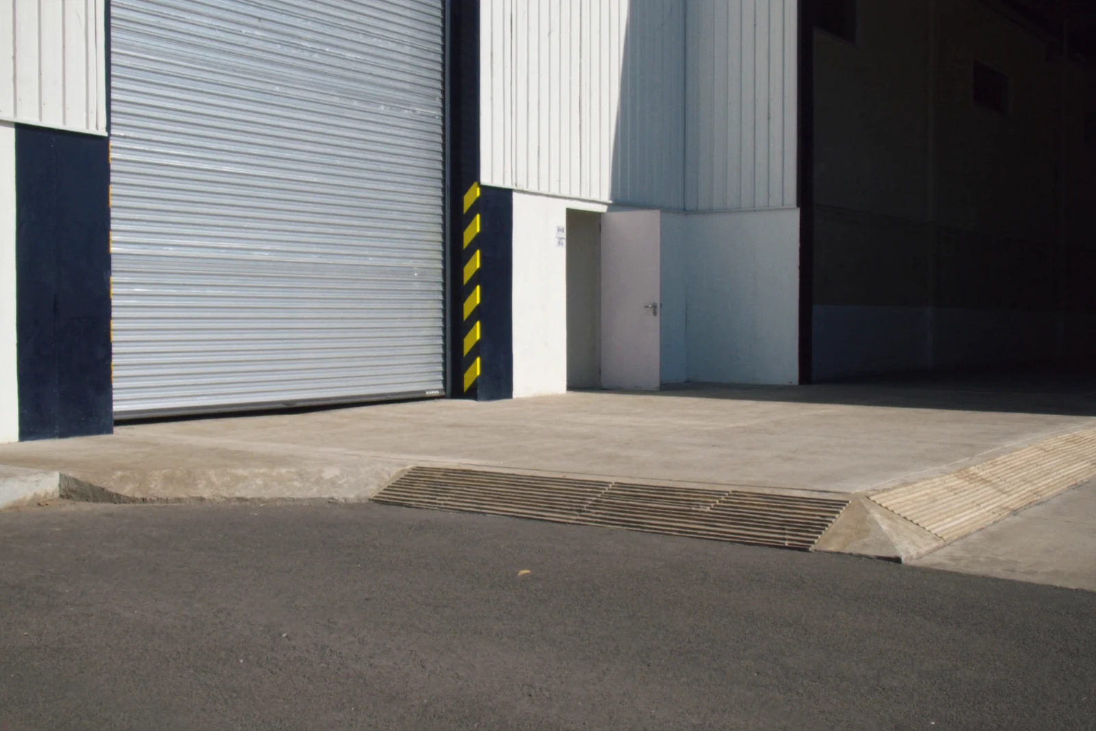 Steel roll-up door at the loading bay of a metal warehouse